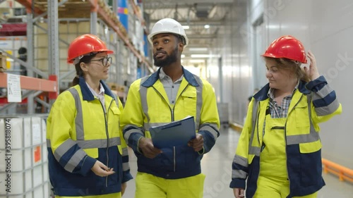 Warehouse workers team inspecting manufacturing storage