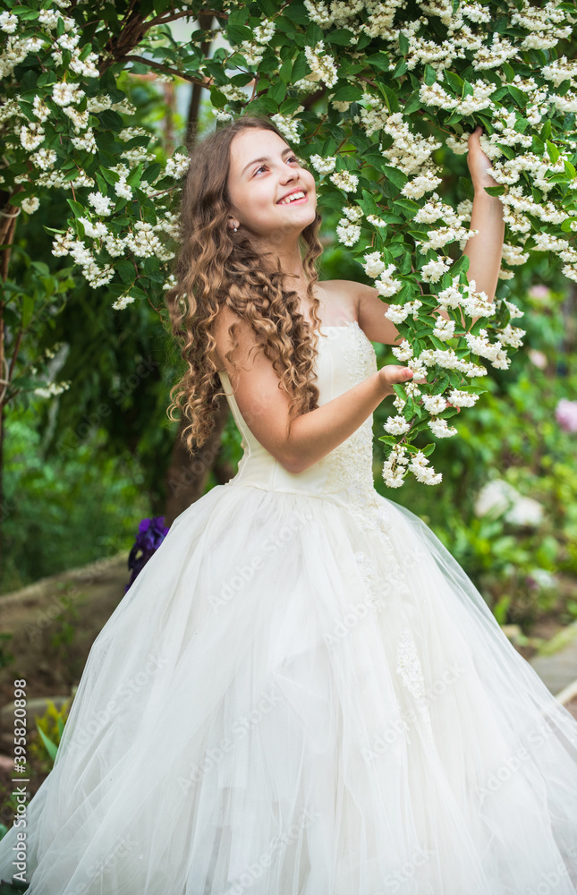 pretty kid smell jasmine flower. spring and summer nature. little girl in garden. child enjoy blossom in park. small angel for bride. cute lady. happy childhood. beauty and fashion. Bride to be pretty kid smell jasmine flower. spring and summer nature. little girl in garden. child enjoy blossom in park. small angel for bride. cute lady. happy childhood. beauty and fashion. Bride to be