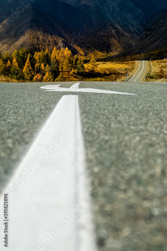 Asphalt road to the mountains. Mountain track on Altai. photo