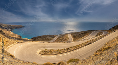 Breathtakingly steep and curvy roads climbing the coastal cliffs of the Sfakia region of Southern Crete, Greece photo