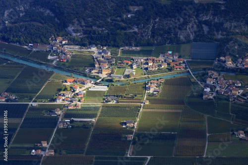 Obraz na płótnie Villages and fields in the valley of Sarca, Sarche, Trentino-Alto Adige, Italy w salonie