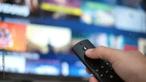 Man hand browsing smart tv apps,zapping channel,leisure lock down home lifestyle