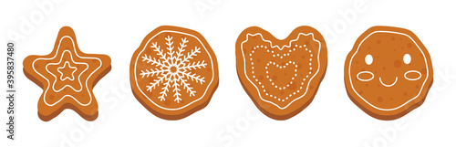 Set of cute shaped gingerbread cookies with winter ornament. A gingerbread heart, a snowflake, a star and a gingerbread man face. Holiday winter symbols isolated on white background in flat design