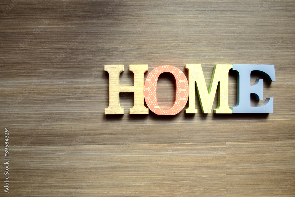 HOME letters on a wooden background HOME letters on a wooden background