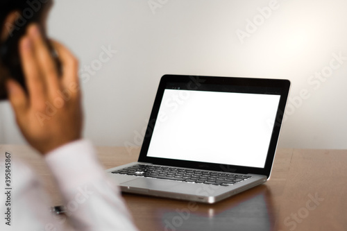 person working on laptop and talking