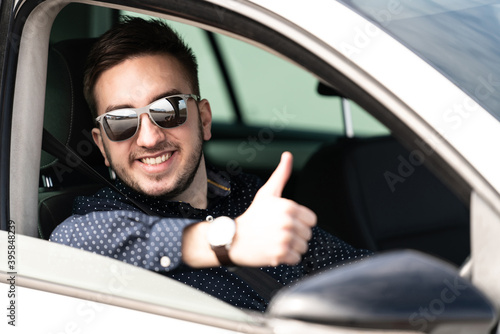 Man Driver in His Car and Showing Thumbs-up