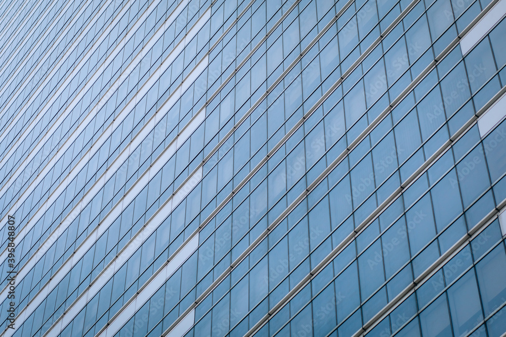 Amazing high-rise glass building with a huge number of identical windows, background Amazing high-rise glass building with a huge number of identical windows, background