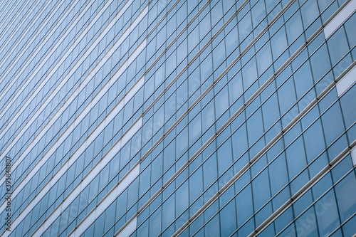 Amazing high-rise glass building with a huge number of identical windows, background