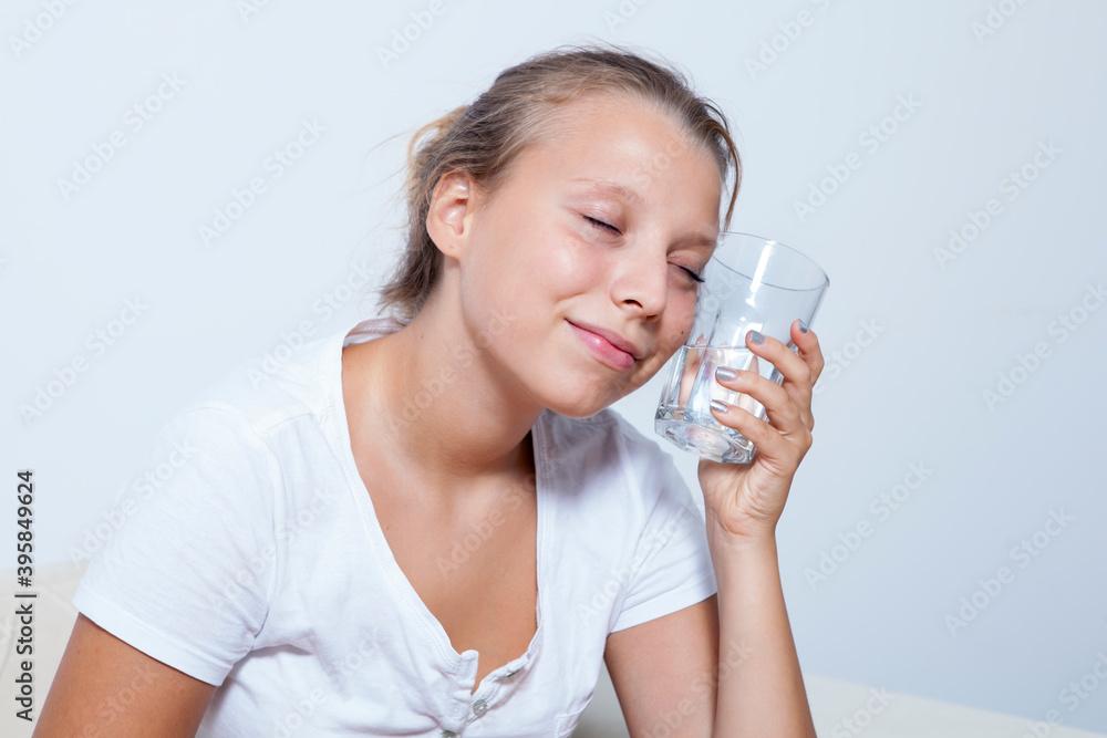 Drinking water. Beautiful teenager girl enjoying pure fresh cool mineral water at morning.
Drinking water. Beautiful teenager girl enjoying pure fresh cool mineral water at morning.