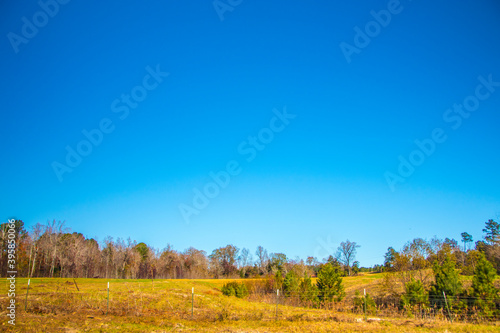 Farm land in rural south Georgia blue sky fence
