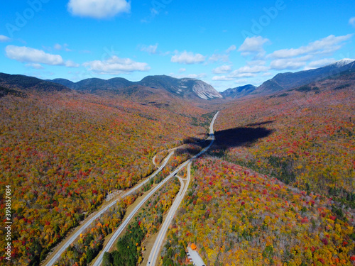 Interstate Highway I-93 across Franconia Notch between Cannon Mountain and Mount Lafayette with fall foliage in Franconia Notch State Park in White Mountain, Lincoln, New Hampshire NH, USA.  photo