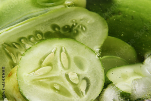 Full frame of sliced cucumber in cold water