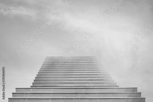 Abstract image of Front view architecture of concrete staircase or ladder leading to sky.