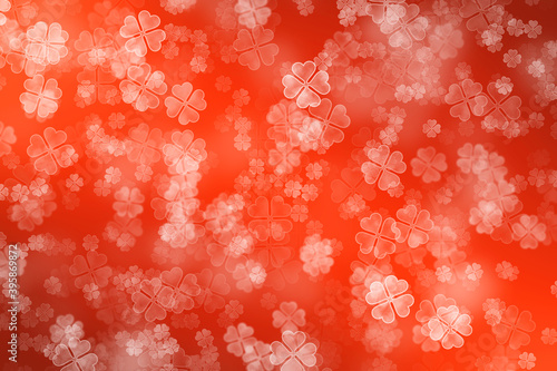 Bokeh background with red and orange colour on   four leaf clover theme