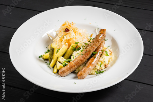 mashed potato with sausage and cabbage salad