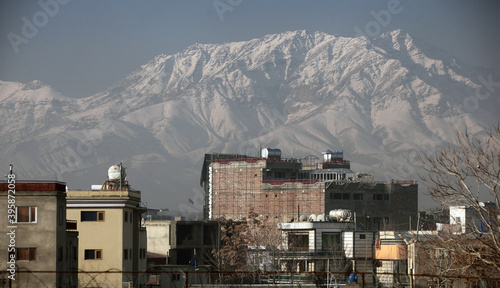 houses in Kabul city with high mountains in the background