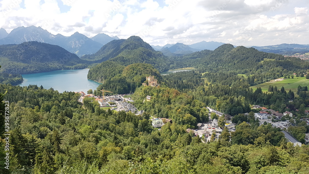 Hohenschwangau castle from a height against the background of mountains and sky in bavaria