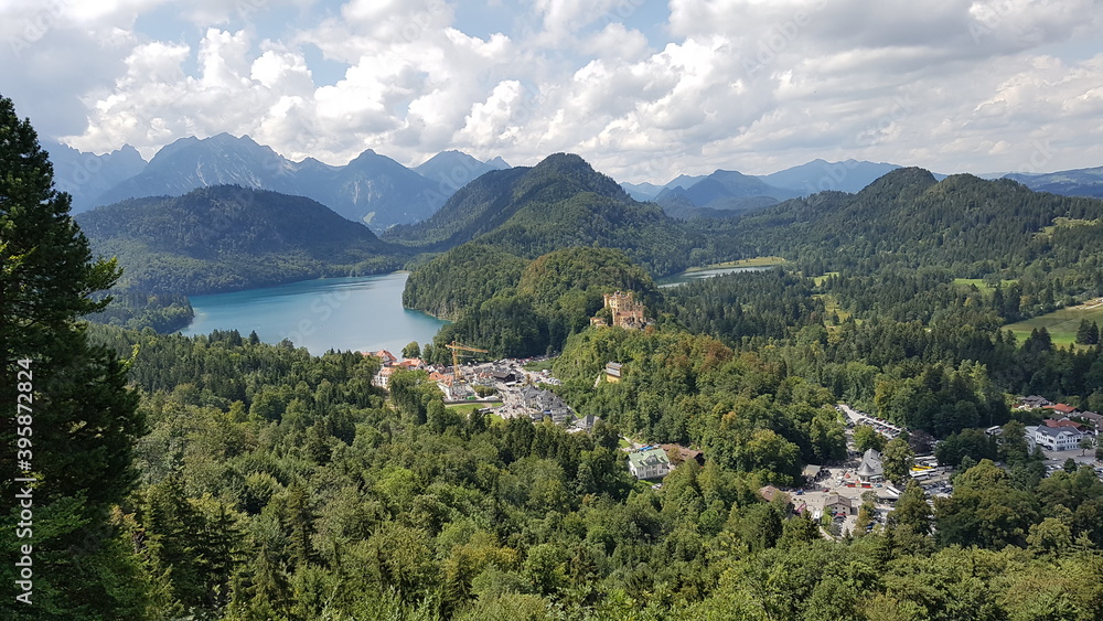 Hohenschwangau castle from a height against the background of mountains and sky in bavaria