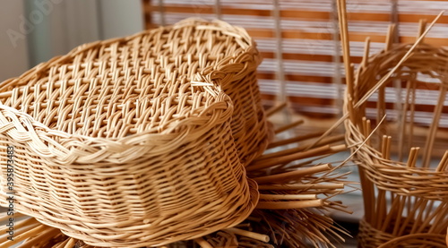 Elements of billets and products of weaving of vines closeup on the background of wooden blinds