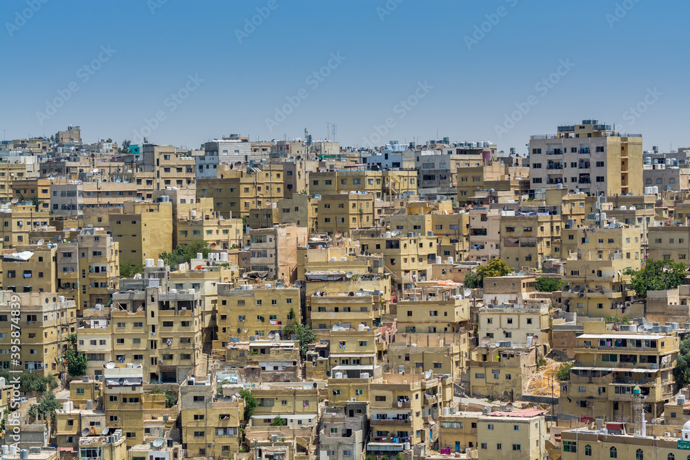 Cityscape of Amman with numerous buildings, the capital and most populous city of Jordan, view from Amman Citadel, known in Arabic as Jabal al-Qal'a.