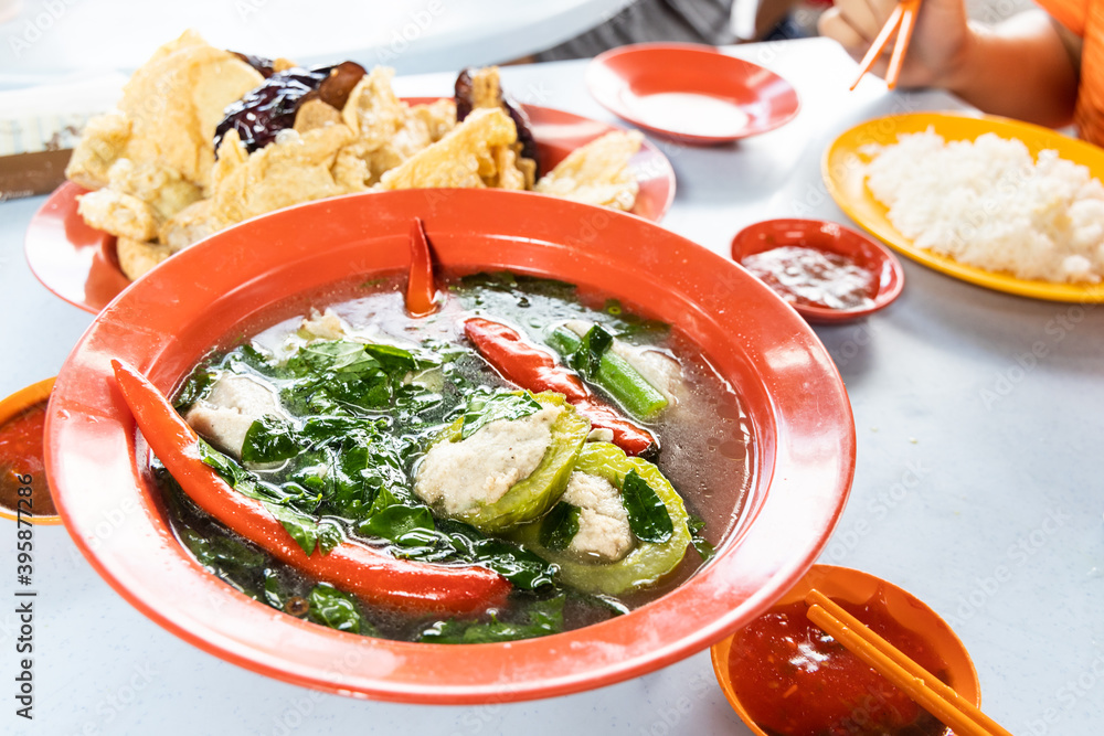 Serving of yong tau fu, Malaysia popular stuffed fish meat in vegetable and tofu. Serving of yong tau fu, Malaysia popular stuffed fish meat in vegetable and tofu.