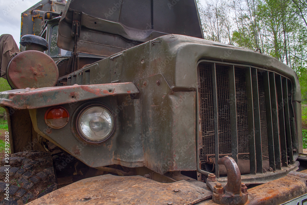 An old, big, rusty car - an all-terrain vehicle.