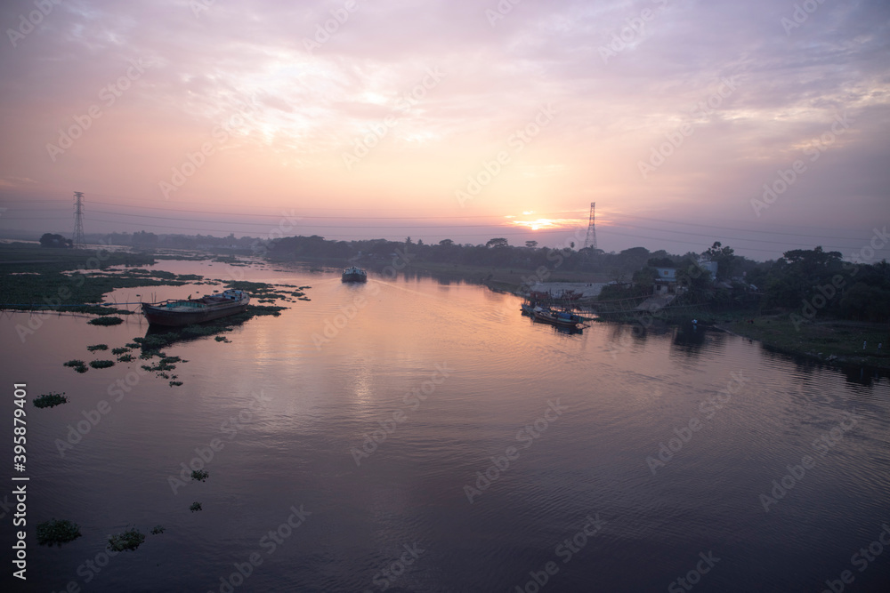 Panoramic view of the boat at the sunset in the riverside Panoramic view of the boat at the sunset in the riverside