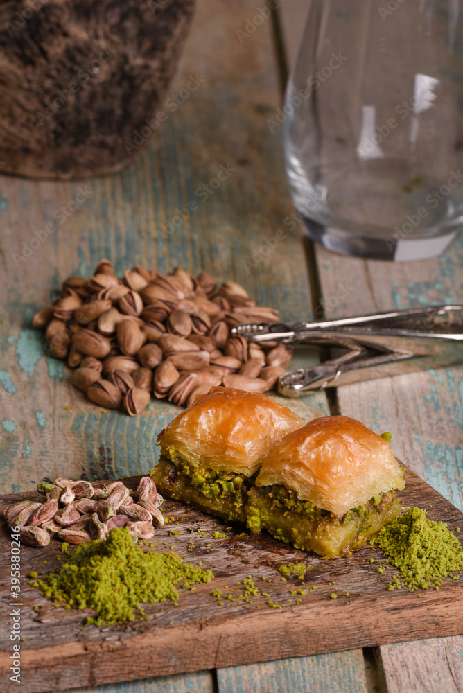 Fototapeta premium World famous baklava making in Gaziantep. Baklava presentation on wooden board. 