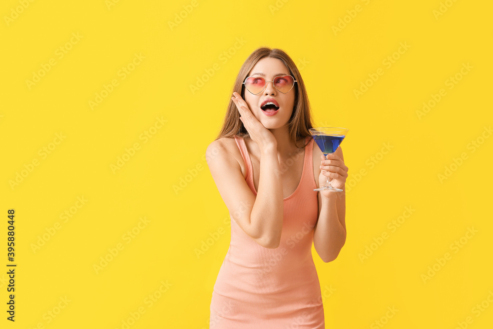 Surprised woman with stylish sunglasses and cocktail on color background Surprised woman with stylish sunglasses and cocktail on color background