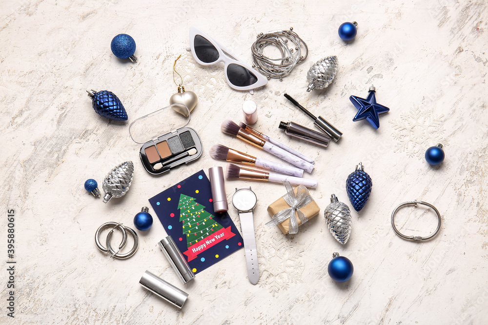 New Year composition with makeup cosmetics on white background New Year composition with makeup cosmetics on white background