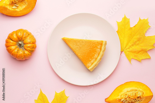 Composition with slice of tasty pumpkin pie on color background photo