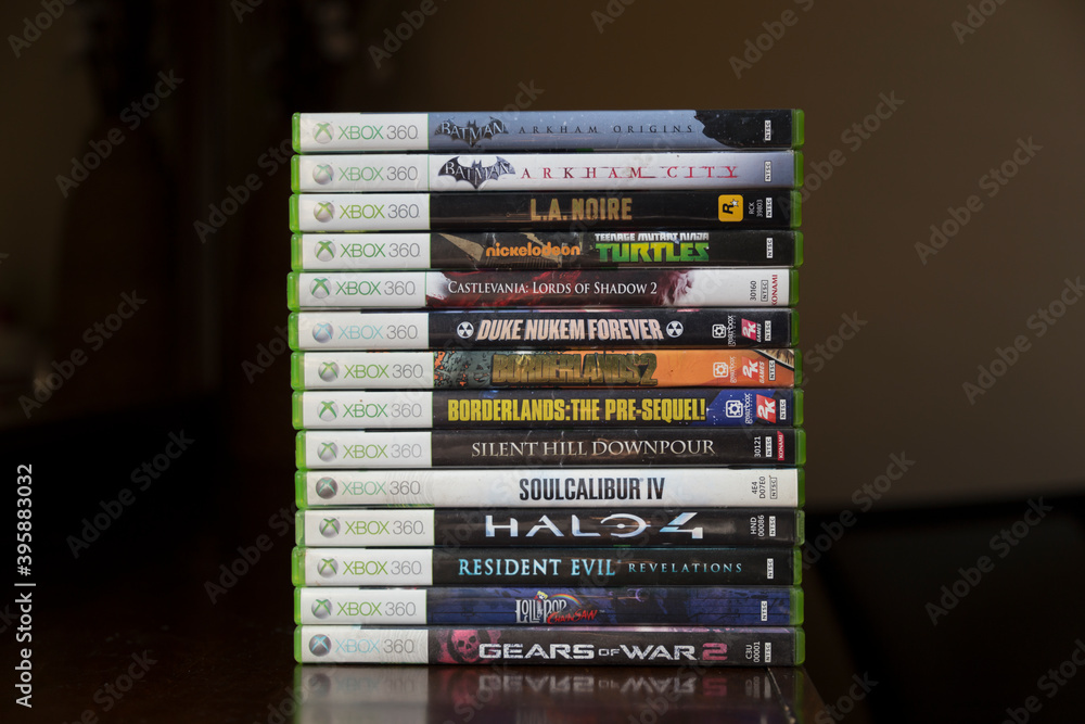 A bunch of Xbox 360 game discs is stacking on top of each other Photos |  Adobe Stock