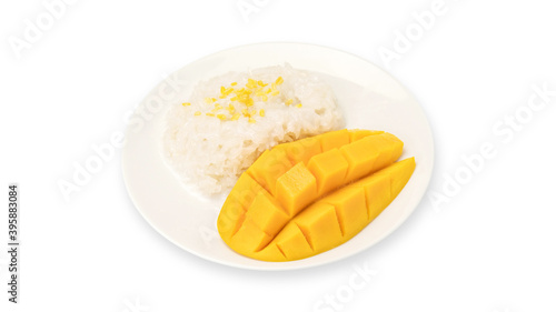 Ripe mango and sticky rice on a white background.