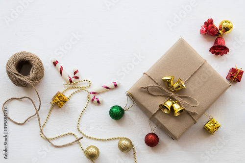 gift box for special in christmas and happy new year festival with decorate small bell on background white wooden