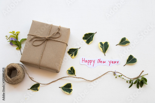 gift box with happy new year message card handwriting for special in new year festival day arrangement on background white