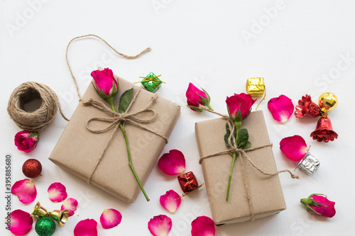 gift box with flower rose for special in christmas and new year festival day arrangement flat lay style on background white