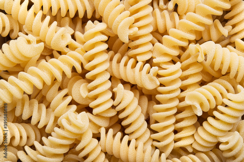 Artisan durum wheat semolina pasta, raw fusilli, top view. Artisan durum wheat semolina pasta, raw fusilli, top view.