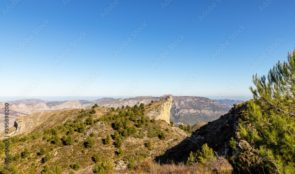 Scenic mountain view of landscape with blue sky