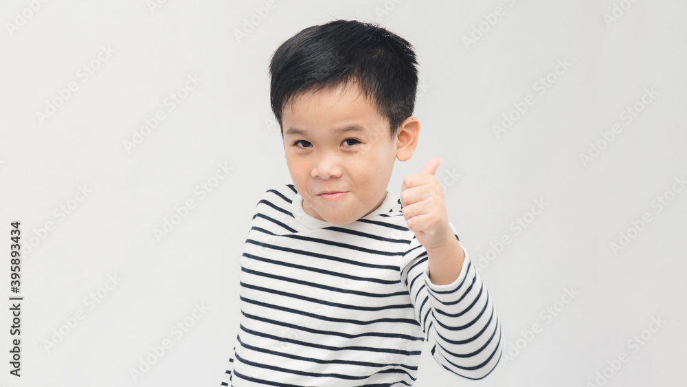 little boy giving you thumbs up, close up little boy giving you thumbs up, close up