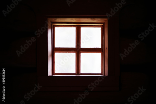 The window of an old wooden house. Textured window silhouette.