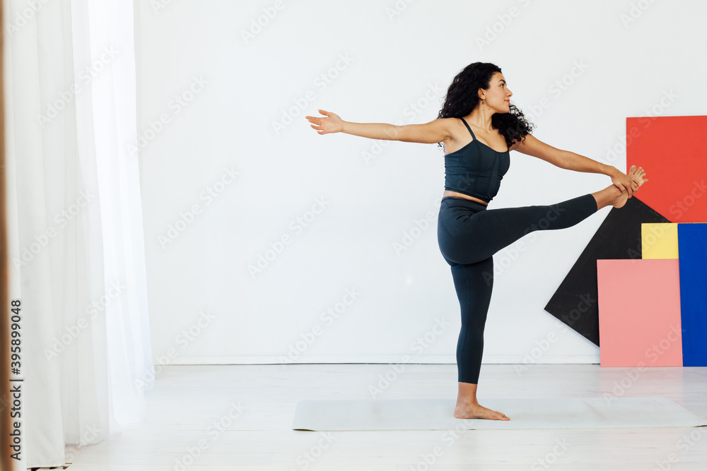 Obraz premium Beautiful brunette woman engaged in yoga asana gymnastics fitness flexibility body