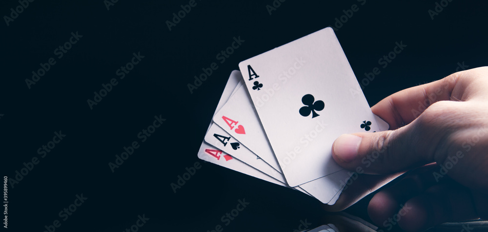 Obraz premium Winning poker hand of four aces playing cards