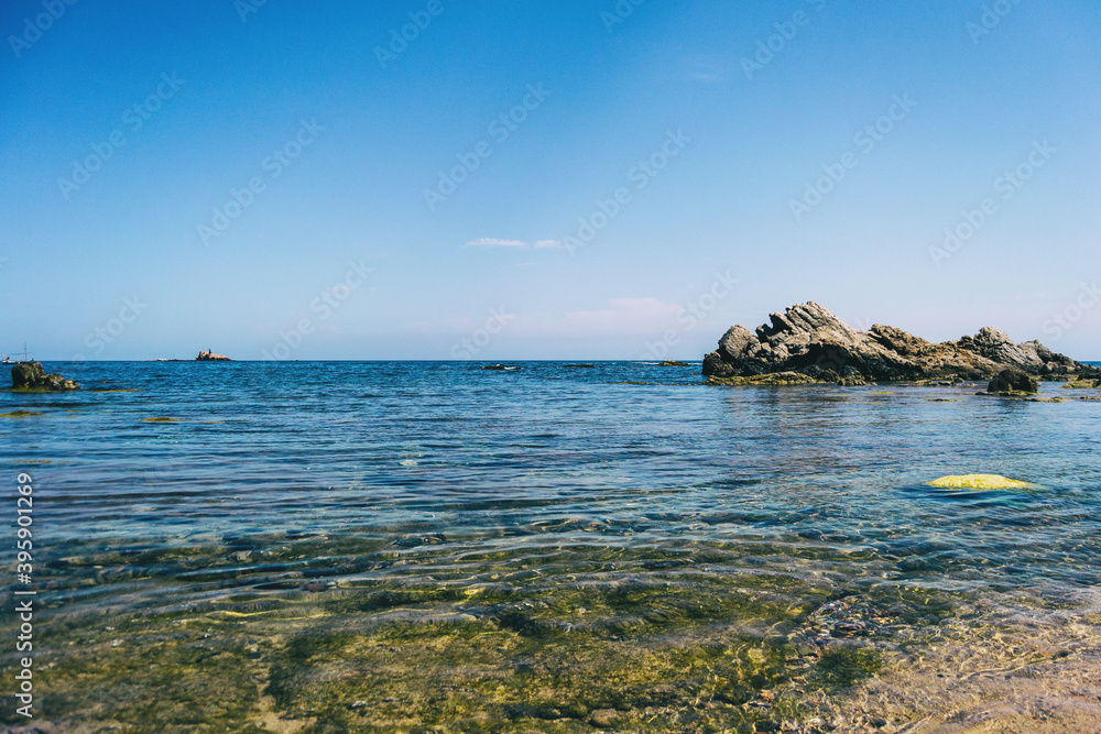 Seascape with crystalline waters and some steep rocks