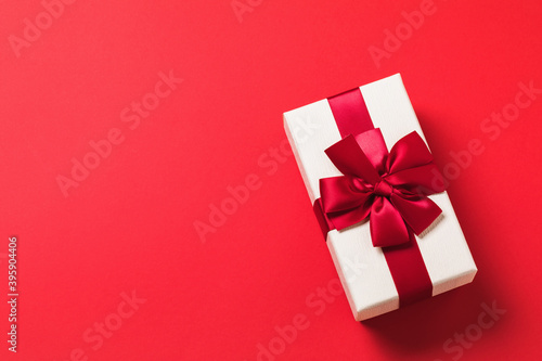 Rectangular gift box on red background with copy of space, top view