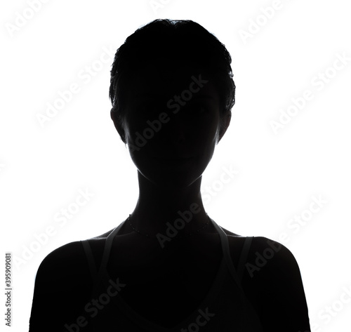 Female person silhouette in the shadow, back lit light © Glebstock