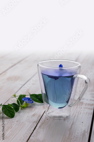 pea blue flower tea in a transparent cup photo