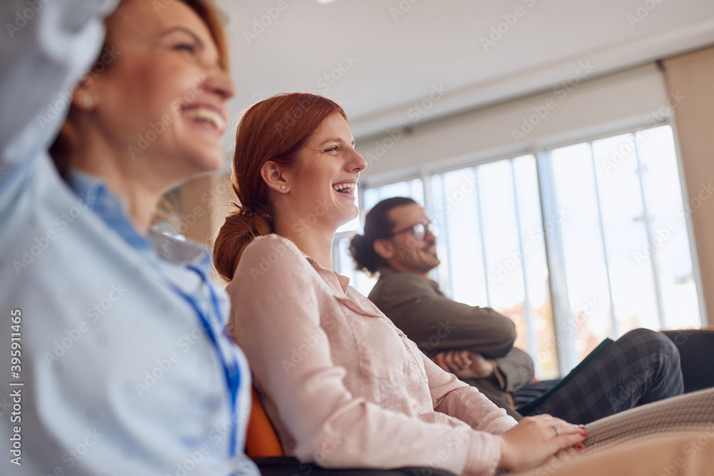 Employees enjoying in the conference hall at the company's briefing. People, job, company, business concept. Employees enjoying in the conference hall at the company's briefing. People, job, company, business concept.
