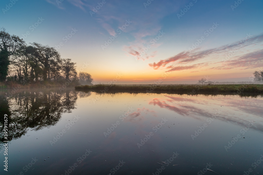 Dutch polder landscape with colorful sunrise Dutch polder landscape with colorful sunrise