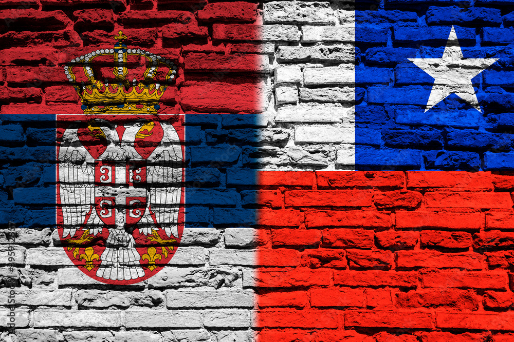 Flag of Serbia and Chile on brick wall