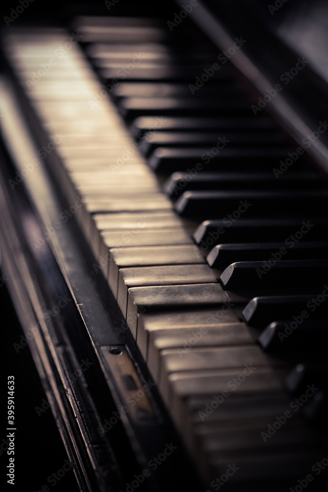 Old piano keyboard, with shallow depth of field